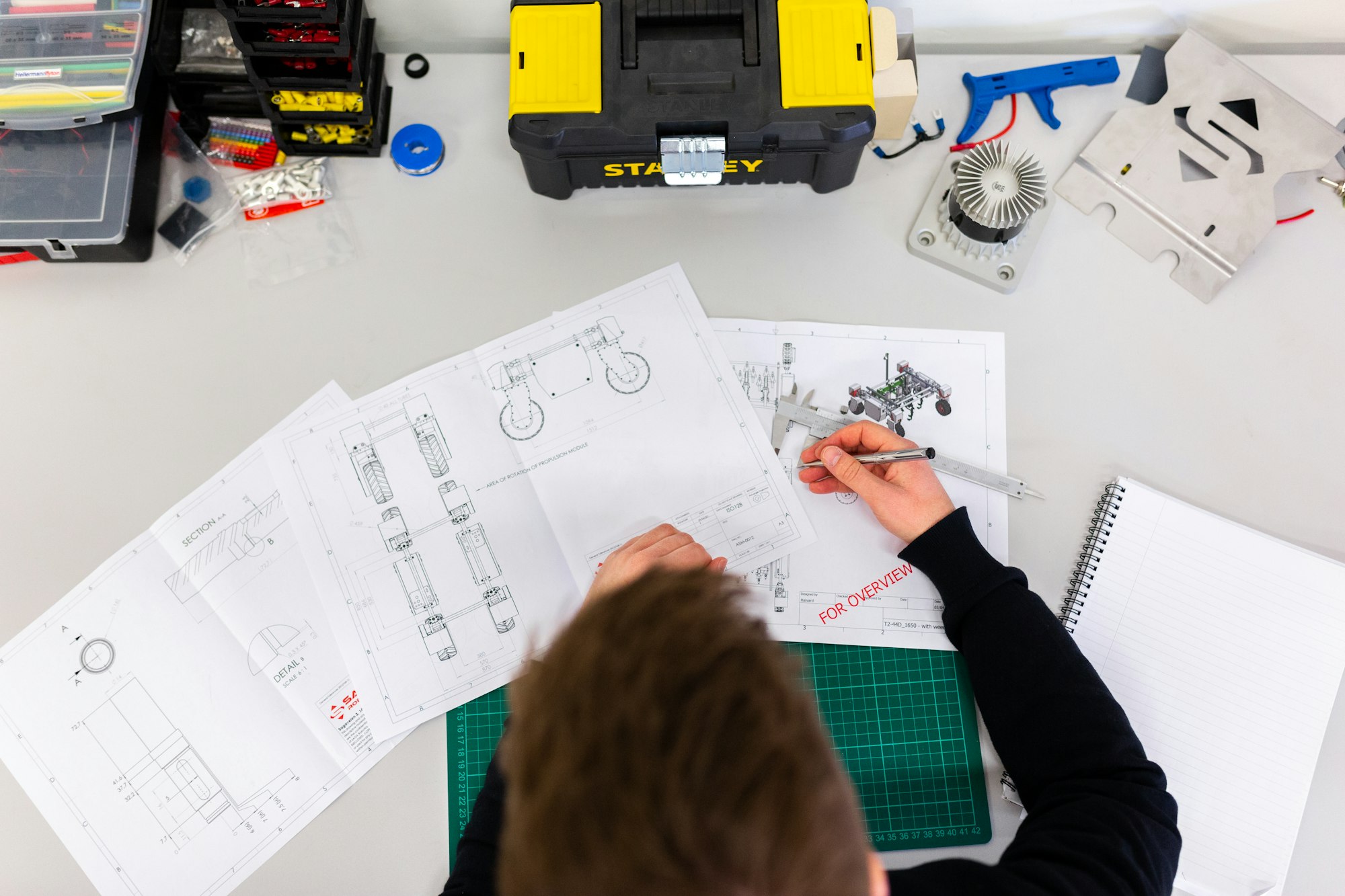 Engineer reviewing part drawings